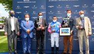 H E Sheikh Ali bin Jassim Al Thani, Ambassador of Qatar to France, and  Edouard de Rotshchild, President of France Galop, pose for a group photograph. 