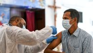 A man receives a dose of a vaccine against the coronavirus disease (COVID-19) at St. Paul's Church in Abu Dhabi, United Arab Emirates January 16, 2021. REUTERS/Khushnum Bhandari/File Photo