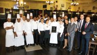 InterContinental Doha staff displaying one of the awards.