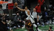 Milwaukee Bucks forward Giannis Antetokounmpo (34) drives to the basket against Atlanta Hawks center Clint Capela (15) n the third quarter during game two of the Eastern Conference Finals for the 2021 NBA Playoffs at Fiserv Forum. Michael McLoone