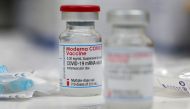 FILE PHOTO: A vial of the Moderna COVID-19 vaccine is seen at a clinic in Aschaffenburg, Germany, January 15, 2021. REUTERS/Kai Pfaffenbach