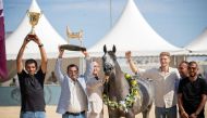 Team Siwar Al Shaqab celebrates with the trophies.