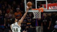 Milwaukee Bucks forward Giannis Antetokounmpo (34) shoots for a basket against the Phoenix Suns during the second half in game two of the 2021 NBA Finals at Phoenix Suns Arena. Mandatory Credit: Joe Camporeale