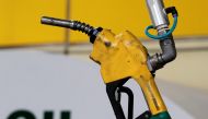 A gas pump is seen hanging from the ceiling at a petrol station in Seoul June 27, 2011. (REUTERS/Jo Yong-Hak/File Photo)