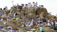 Pilgrims gather on Mount Mercy on the plains of Arafat during the annual Haj pilgrimage as the country barred worshippers from abroad for a second year running due to the coronavirus disease (COVID-19) pandemic, outside the holy city of Mecca, Saudi Arabi