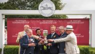 Jassim Moftah J M Al Moftah, Acting Deputy Ambassador of Qatar to the UK, presents the trophy to connection of Trueshan, which won the Al Shaqab Goodwood Cup Stakes (Group One) at Qatar Goodwood Festival yesterday.