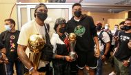 Milwaukee Bucks forward Giannis Antetokounmpo, Milwaukee Bucks forward Thanasis Antetokounmpo and their mother Veronica Antetokounmpo pose for a picture as they arrive at the Eleftherios Venizelos International Airport in Athens, Greece, August 1, 2021. T