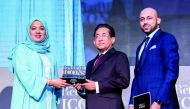 Chairman of Joyalukkas Group Joy Alukkas receiving RetailME ICONS award from Laila Mohammed Suhail, CEO at Strategic Alliance and Partnership, Dubai Department of Tourism & Commerce Marketing in the presence of John Paul Alukkas, Managing Director, Joyalu