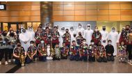 Officials of the Qatar Table Tennis Association pose for a photograph with the Team Qatar paddlers and officials upon their return to Doha at the Hamad International Airport yesterday. Pic: Abdul Basit