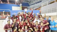 President of the Qatar Swimming Association, Khalil Al Jaber poses for a photograph with officials and the Qatari swimmers who won medals at the 28th GCC Aquatics Championship at the Hamad Aquatic Centre in Doha, yesterday. Qatar bagged an outstanding med