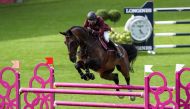 Doha Falcons' Qatari rider  Bassem Mohammed guides Gunder over an obstacle.