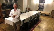 Serge Colliou poses inside a WW2-era German bunker renovated and turned into a guest house for rent on Airbnb, in Saint-Pabu, France, August 19, 2021. Reuters/Manuel Ausloos