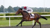 Richard Kingscote guides Al Shaqab Racing-owned two-year-old colt Migdam towards the finish line at Kempton. Pic: Steve Davies