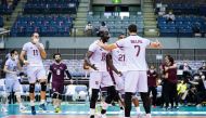 Qatar players celebrate their win.