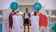 The podium winners of the fourth and final stage of the Tour of Salalah with officials during the presentation ceremony.