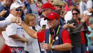 Team USA captain Steve Stricker acknowledges fans as he walks up the 2nd hole during the Singles REUTERS/Mike Segar
