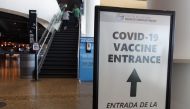 May 2, 2021; Milwaukee, Wisconsin, USA; A sign directing fans where to receive a COVID-19 vaccination prior to the game between the Milwaukee Bucks and the Brooklyn Netsat Fiserv Forum. /Jeff Hanisch-USA TODAY Sports/File Photo