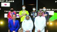 Asian Table Tennis Union President Khalil Al Mohannadi and other officials pose for a photograph with the men's singles podium winners.