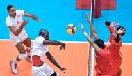 An Al Arabi player (left) smashes a shot during the match against Rebisco Philippines yesterday.  