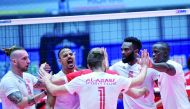 Al Arabi players celebrate after winning yesterday's match.