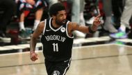 Brooklyn Nets point guard Kyrie Irving (11) reacts after making a basket against the Milwaukee Bucks during the second quarter of game one in the Eastern Conference semifinals of the 2021 NBA Playoffs at Barclays Center. Mandatory Credit: Brad Penner-USA 