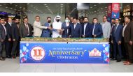 Management members and officials cutting a cake to mark Safari Mall's 11th anniversary. 