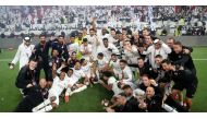 Al Sadd players and officials celebrate after winning the Amir Cup.