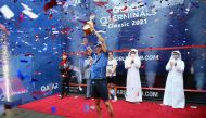 Peru’s Diego Elias lifts the Qatar QTerminals Classic trophy after winning the final. Qatar Tennis, Squash and Badminton Federation President Nasser bin Ghanim Al Khelaifi and QTSBF Secretary-General Tareq Zainal are also present.