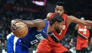 LA Clippers guard Paul George (13) tries to dribble the ball past Portland Trail Blazers guard CJ McCollum (3) in the seconds quarter at Staples Center. Robert Hanashiro