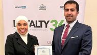 Sabah Rabiah Al Kuwari (right), Director  of Public Relation, and Mayasa Alhejazi, Acting Assistant Director, Loyalty, receiving the award.
