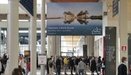 People visit the Qatar pavilion at the TTG Travel Experience, in Rimini, Italy. 