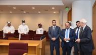 Iraq’s Minister of Justice H E Salar Abdul Sattar Muhammad with officials from Qatar International Court and Dispute Resolution Centre in Doha, yesterday. 