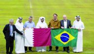 President of Brazil H E Jair Bolsonaro, FIFA President Gianni Infantino, Secretary-General of Supreme Committee for Delivery & Legacy Hassan Al Thawadi, CEO of the FIFA World Cup Qatar 2022 Nasser Al Khater and other top officials pose for a photograph at the Lusail Stadium