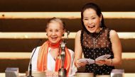 Japanese Oscar-winning movie costume designer Emi Wada (L) and Hong Kong actress Cecilia Yip present an award at the 25th Hong Kong Film Awards, April 8, 2006. REUTERS/Paul Yeung/File Photo