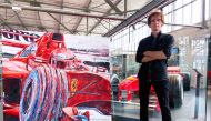 Renowned painter and official artist of Formula 1, Armin Flossdorf, with his artworks.