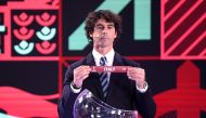 Portuguese former football player Tiago picks Italy during the draw for the European and Intercontinental play-offs for the FIFA World Cup Qatar 2022, in Zurich.