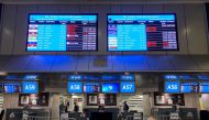 Digital display boards show cancelled flights to London - Heathrow at O.R. Tambo International Airport in Johannesburg, South Africa, November 26, 2021. REUTERS/ Sumaya Hisham/File Photo.