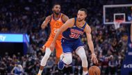 Golden State Warriors guard Stephen Curry (30) dribbles past Phoenix Suns forward Mikal Bridges (25) in the fourth quarter at the Chase Center. Cary Edmondson