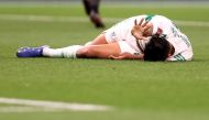 Algeria’s Baghdad Bounedjah reacts after sustaining an injury during the match against Egypt on Tuesday.