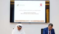 Qatar University President Dr. Hassan Al Derham and IHU President Dr. Atilla Arkan signing the agreement.