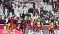 Qatar players celebrate with fans after the quarter-final against the United Arab Emirates.