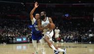 Los Angeles, California, USA; Brooklyn Nets guard James Harden (13) is defended by LA Clippers guard Keon Johnson (45) in the second half at Crypto.com Arena. Kirby Lee