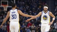 Golden State Warriors guard Klay Thompson (11) gets a congratulatory handshake from teammate Stephen Curry (30) after making a basket against the Cleveland Cavaliers during the first quarter at Chase Center. Mandatory Credit: D. Ross Cameron
