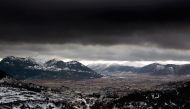 A storm approaches the snow covered mountain range of Panachaiko, near Kalavryta, some 200 km (124 miles) south-west of Athens in Peloponnese district February 29, 2012. REUTERS/Yannis Behrakis

