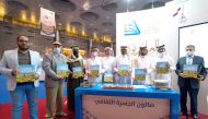 Officials at the launch of ‘Eco Tourism in Qatar’ at Doha International Book Fair, yesterday. 