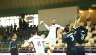 A Qatari player prepares to shoot at the goal during the match against Uzbekistan, yesterday