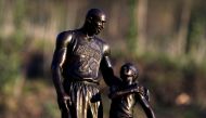 A temporary statue of Kobe and Gigi Bryant at the helicopter crash site two years ago today in Calabasas, California, U.S., January 26, 2022. Reuters/David Swanson