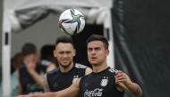 Argentina’s Paulo Dybala with a team-mate during a  training session, yesterday.