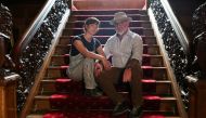 American property developers and conservationists Camille and Christopher Bently pose for a portrait on a staircase at their Kildrummy Estate, Scotland, Britain, September 7, 2021. Reuters/Russell Cheyne