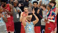 Team LeBron guard Stephen Curry (30) celebrates with a trophy for most valuable player after Team LeBron defeated Team Durant in the 2022 NBA All-Star Game at Rocket Mortgage FieldHouse. David Richard-USA TODAY Sports